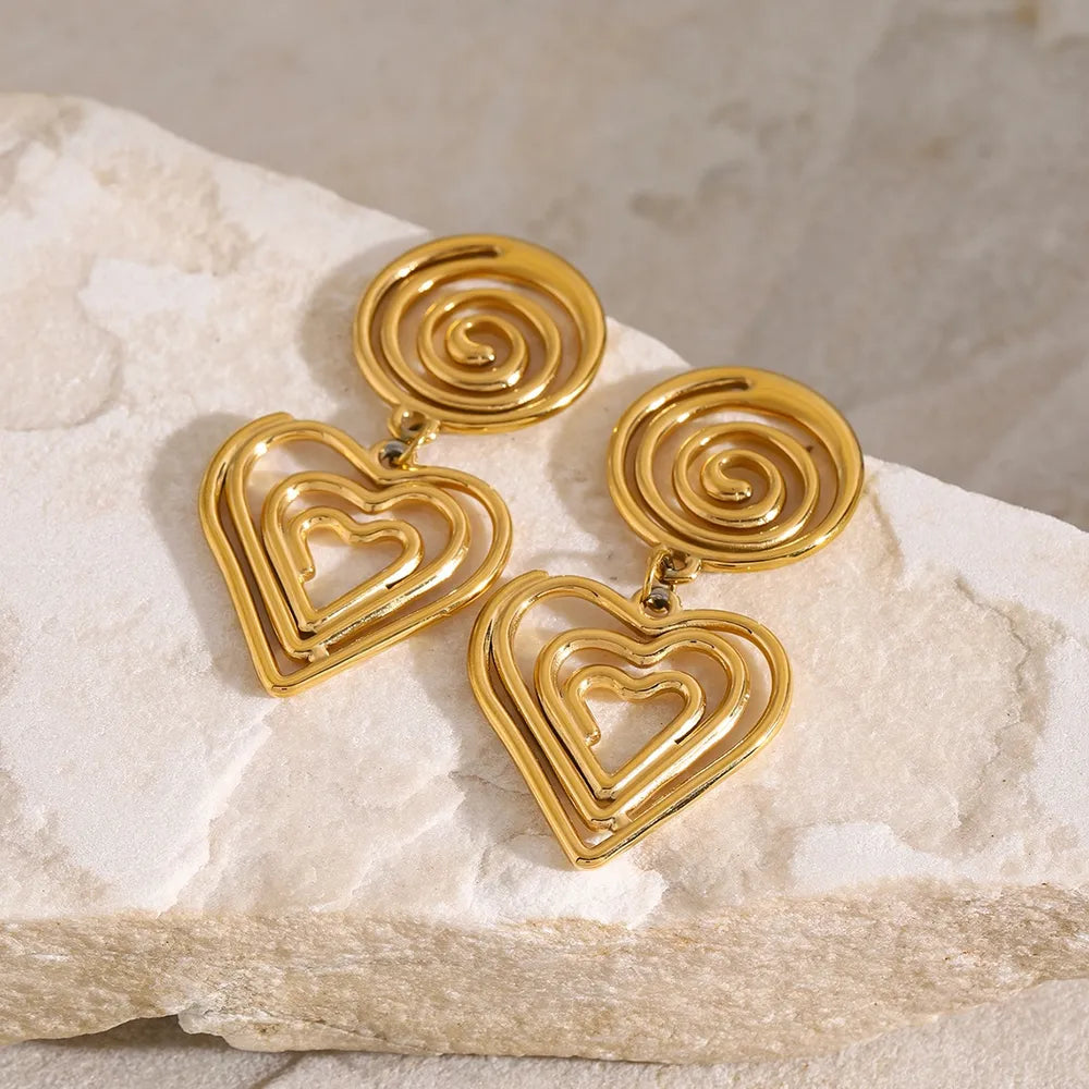Gold-plated stainless steel heart earrings with spiral top design, elegant and romantic accessory for any outfit.