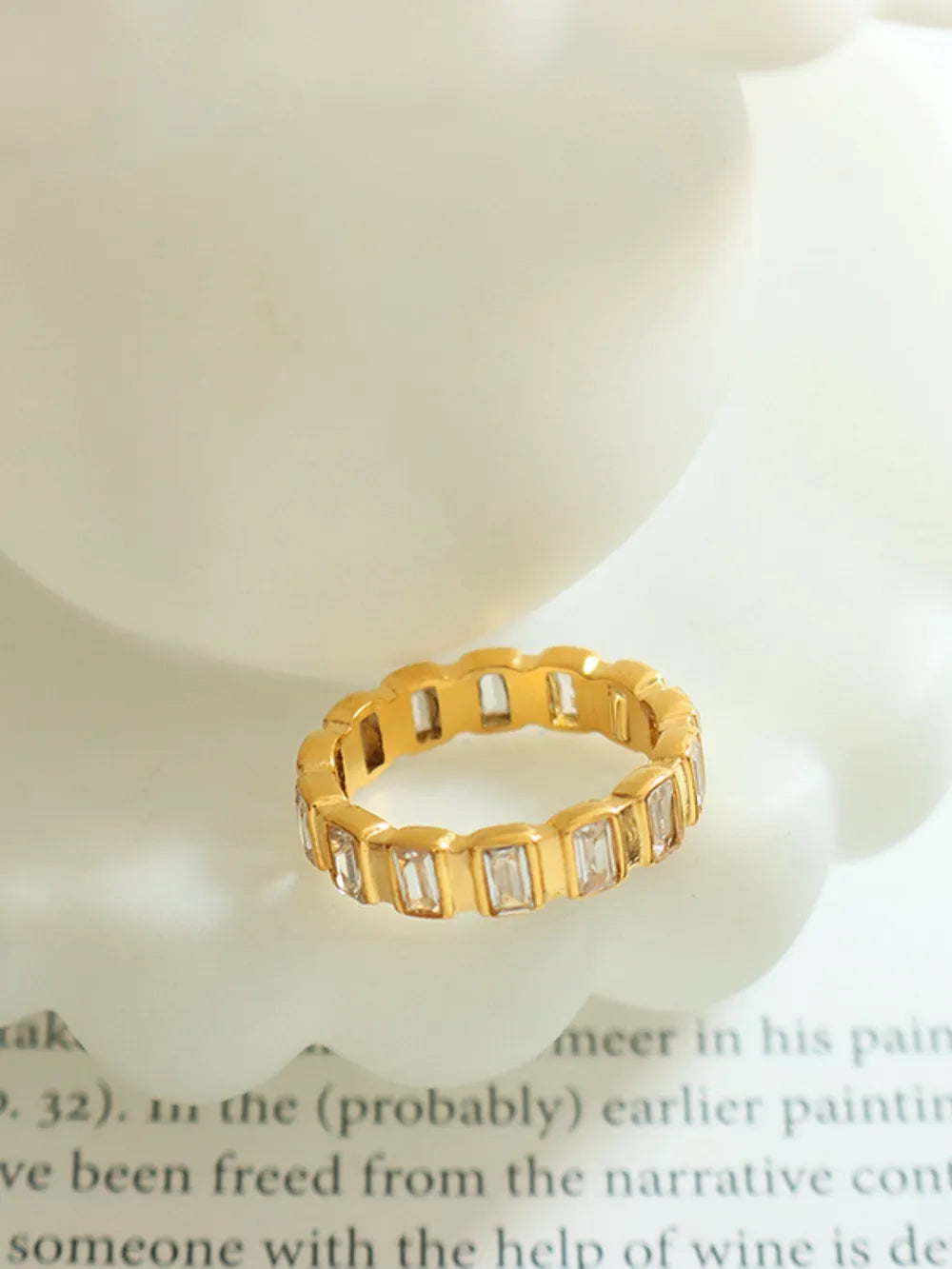 Gold titanium steel ring with rhinestones, showcasing a premium inlaid design, perfect for casual or formal occasions.