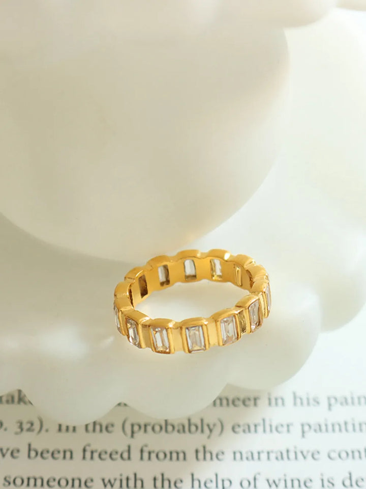 Gold titanium steel ring with rhinestones, showcasing a premium inlaid design, perfect for casual or formal occasions.