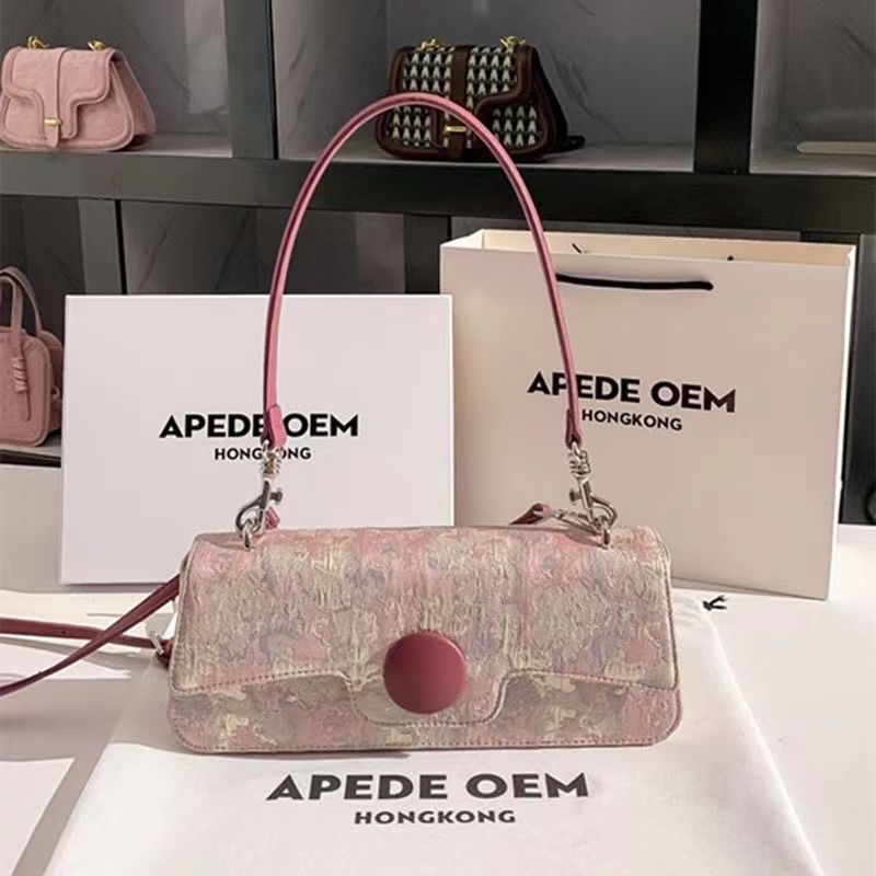 Pink floral handbag on a white surface with 'APEDE OEM Hong Kong' branding.
