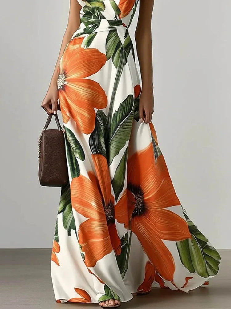 Woman wearing an orange floral dress  on a plain background