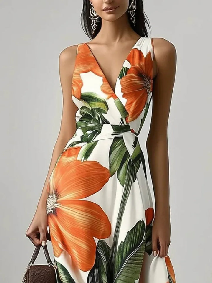 Woman wearing an orange floral dress  on a gray background