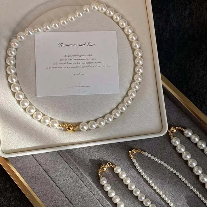 Elegant white pearl necklace displayed with a heartfelt message about romance and love.