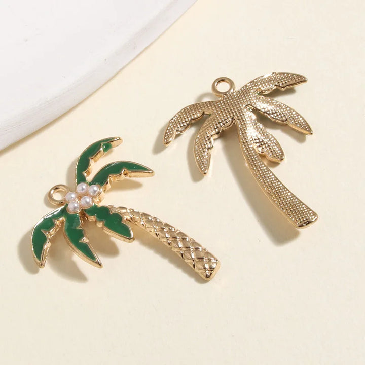 Gold coconut palm tree charms with green accents and pearls, ideal for tropical jewelry making supplies.