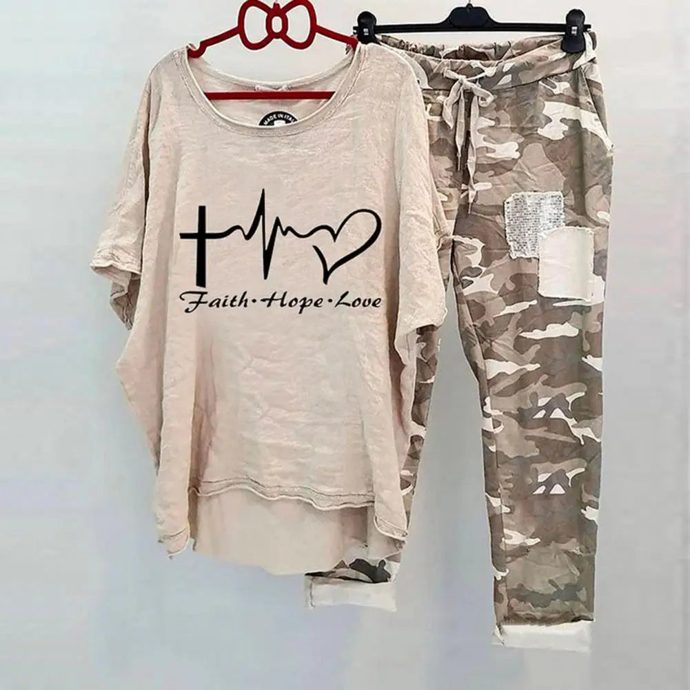 Women Cotton Blend Sportswear Set featuring a beige top with a heart and cross design and camo pants.