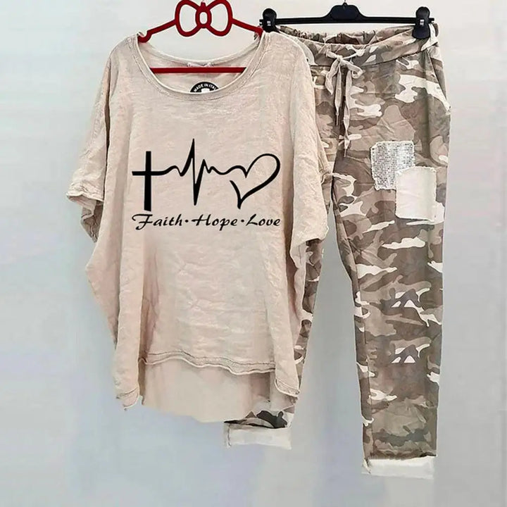 Women Cotton Blend Sportswear Set featuring a beige top with a heart and cross design and camo pants.