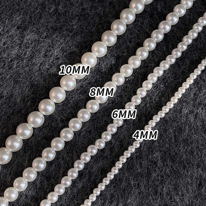 Different sizes of white pearl strands labeled 4MM, 6MM, 8MM, and 10MM on a textured background.