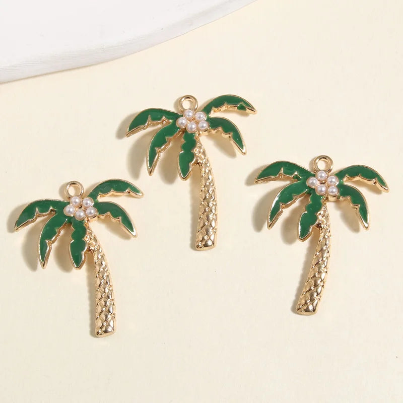Set of 3 gold coconut palm tree charms with green leaves and pearl accents for jewelry making supplies.