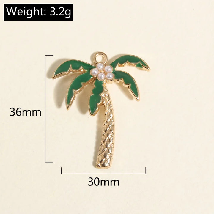 Gold coconut palm tree charm with green leaves and pearls, measuring 36x30mm, perfect for jewelry making.