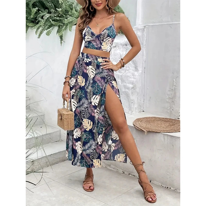 Woman wearing a colorful summer vest and skirt set in a minimalistic indoor setting.