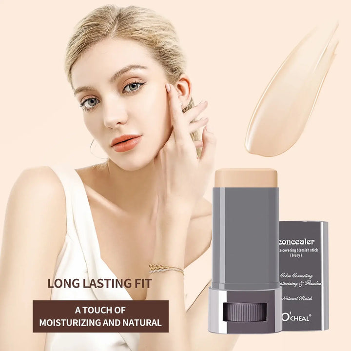 Woman applying concealer stick with product packaging on a beige background