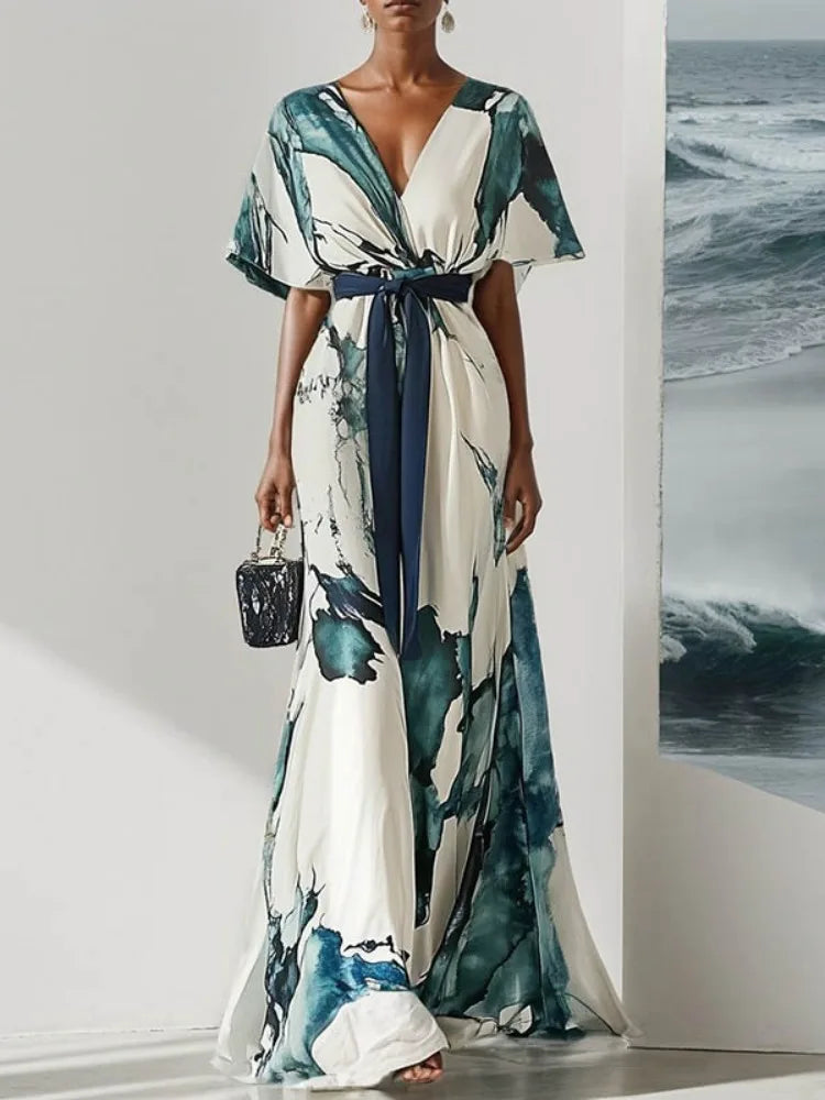 Woman wearing a watercolor dress with a white background